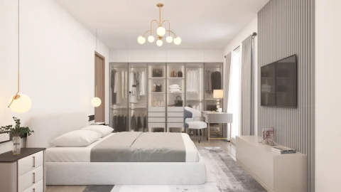 Modern eingerichtetes Schlafzimmer mit einem großen Bett in der Mitte, darüber hängende Lampen. An der Wand eine gläserne Kleiderschrankwand und ein Arbeitsbereich mit Stuhl und Tisch. Rechts befindet sich ein Fernseher.