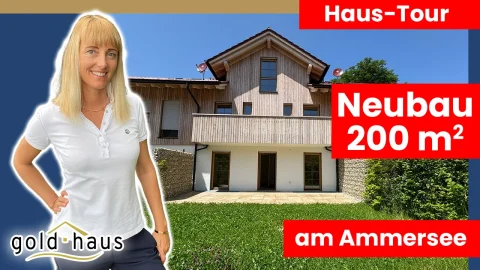 Ein YouTube-Thumbnail zeigt Myriam Goldhofer vor einem modernen Haus mit Holzfassade. Text-Overlays: Haus-Tour, Neubau 200 m² am Ammersee und das Logo Der Goldhaus-GmbH (Immobilienmakler Herrsching)